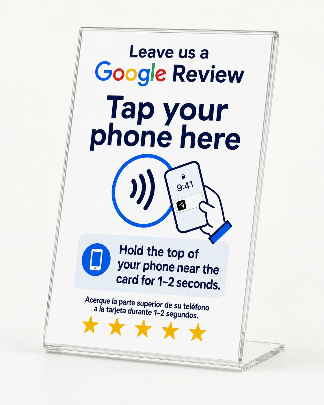 Clear acrylic Google Review Stand reading 'Leave us a Google Review — tap your phone here', with an NFC tap circle, phone illustration, hold-your-phone instructions in English and Spanish, and five stars